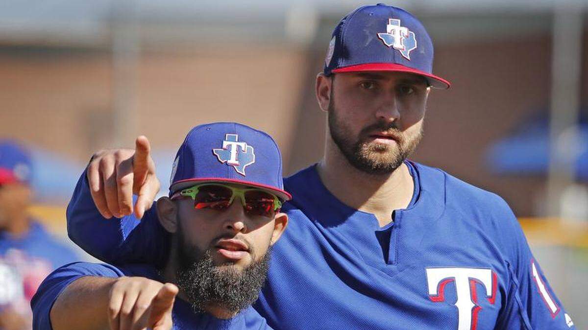 Texas Rangers goofballs Rougned Odor and Joey Gallo play around with the photographer Tuesday between infielder drills. The second baseman and first baseman are reasons Rangers fans should be excited about 2018, manager Jeff Banister said.