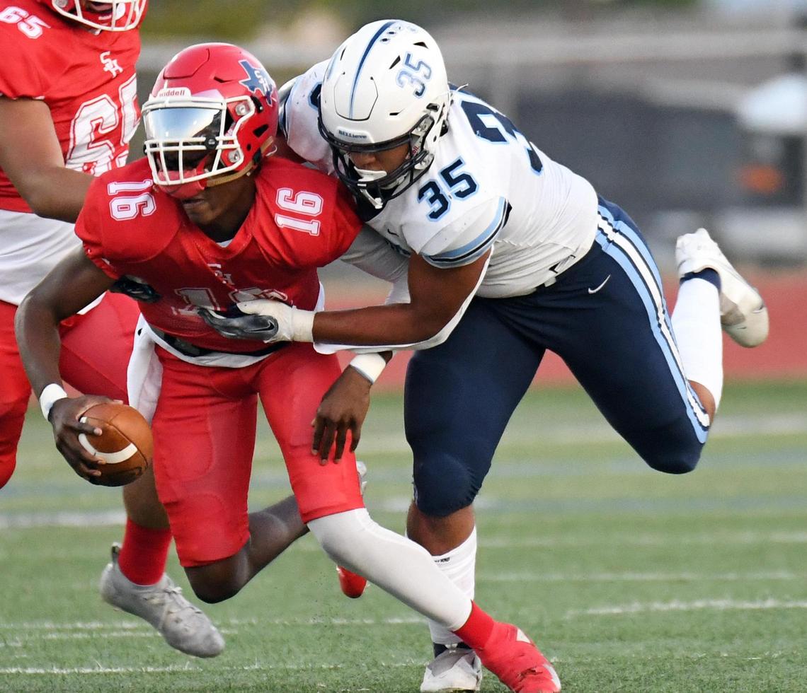 Sam Houston quarterback Andre Saulsbury, left is sacked by Bell’s Tristan Johnson in the second quarter of Friday’s September 9, 2022 football game at Wilemon Field in Arlington, Texas. Special/Bob Haynes