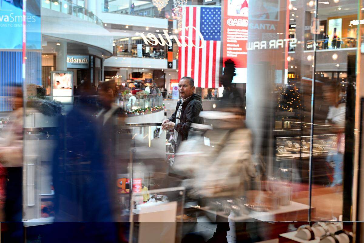 Customers looking for deals walk in a mall on Black Friday in Arlington, Virginia on November 29, 2024. The annual Black Friday shopping day has always been about finding the best deals, but this year retailers are preparing for a US consumer more zealously fixated than ever on getting value for their money.
