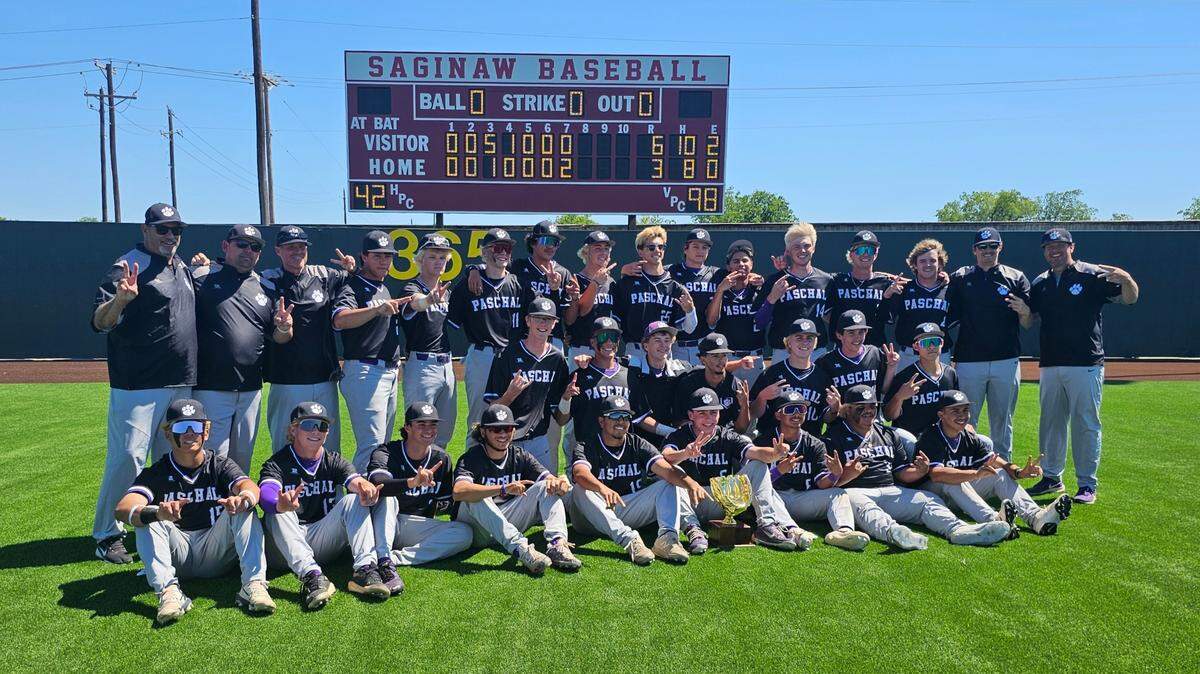 The Fort Worth Paschal baseball team poses with the trophy after defeating Burleson, 6-3, in Game 3 to win its Class 5A Division 1 bi-district series on Saturday, May 3, 2025 at Saginaw High School in Saginaw, Texas.