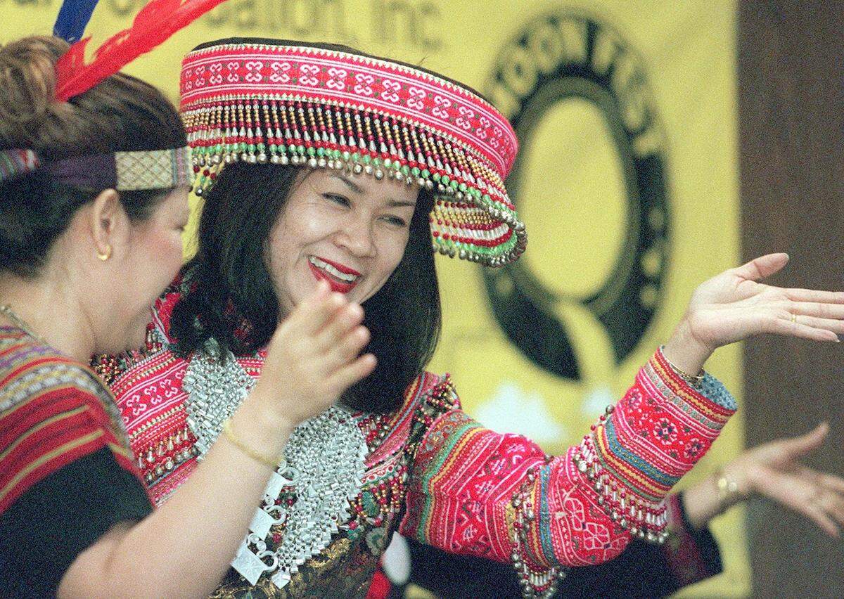 2001: ViengKham Phommavong of Euless, right, and Kongsy Bone of Fort Worth perform a traditional Laotian dance at the 2001 Mid-Autumn Moon Festival