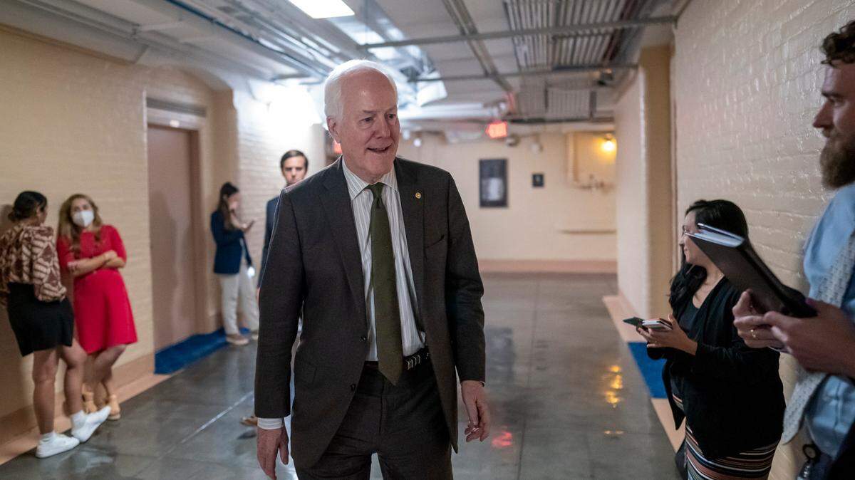 Sen. John Cornyn, R-Texas, arrives to meet with Sen. Chris Murphy, D-Conn., and Sen. Kyrsten Sinema, D-Ariz., arrive for more bipartisan talks on how to rein in gun violence, at the Capitol in Washington on Wednesday.