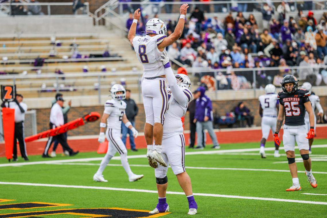 Alvarado running back DJ Clampitt (8) gets a lift from an offensive lineman after a TD run during a Class 4A Division I regional semifinal Friday, Nov. 28, 2025, at Knight Stadium at Eagle Mountain High School in Fort Worth.