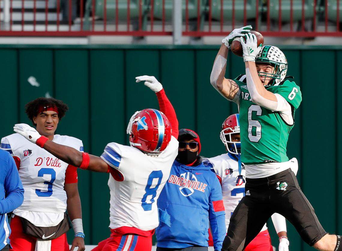 Southlake receiver Landon Samson grabs a pass in front of Duncanville linebacker Jadarius Thursby (8) during the Conference 6A Division 1 2020 state championship semi-final football game at Globe Life Park in Arlington, Texas, Saturday, Jan. 09, 2021. Duncanville led 27-21 at the half. (Special to the Star-Telegram Bob Booth)