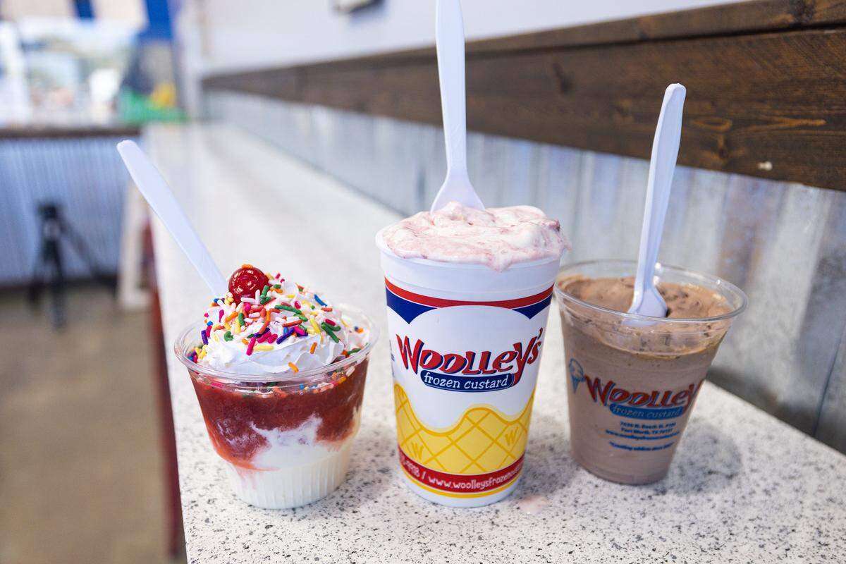 A strawberry vanilla frozen custard sundae, left, strawberry cheesecake concrete, middle, and peanut butter chocolate concrete at Woolley's Frozen Custard in Keller on Wednesday, Sept. 10, 2025. Woolley's was voted as the Best Ice Cream in Fort Worth by Star-Telegram readers.