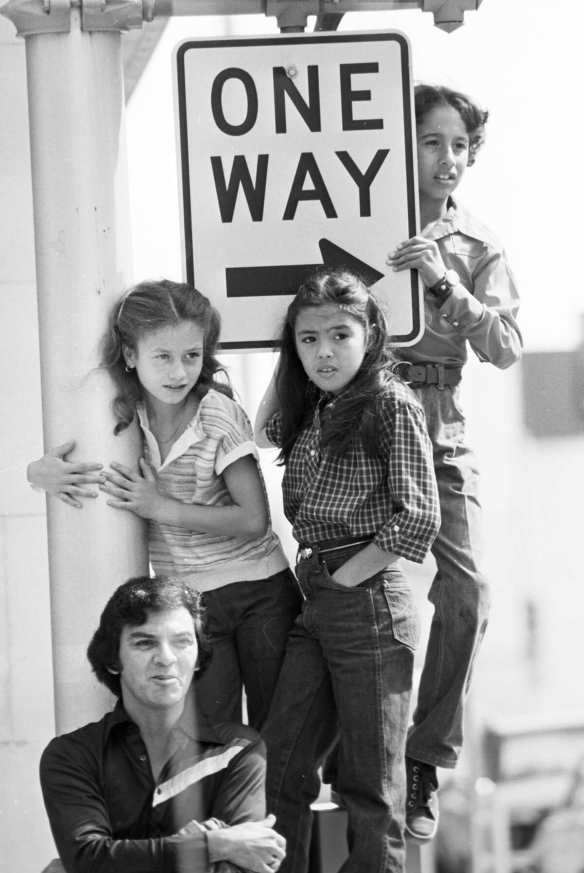 Sept. 16, 1979: Louis Pantonja, his daughter Selena, Desiree Diaz and John Ramirez, left to right, were among the spectators at a downtown parade celebrating Mexico Independence Day. Maricella Garcia, a 17-year-old student at Eastern Hills High School, was crowned Miss Mexican Independence.