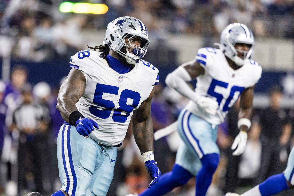 Cowboys defensive tackle Mazi Smith (58) chases after Raven quarterback Cooper Rush (15) in the first half of an NFL preseason game between the Dallas Cowboys and the Baltimore Ravens at AT&T Stadium in Arlington on Saturday, Aug. 16, 2025.