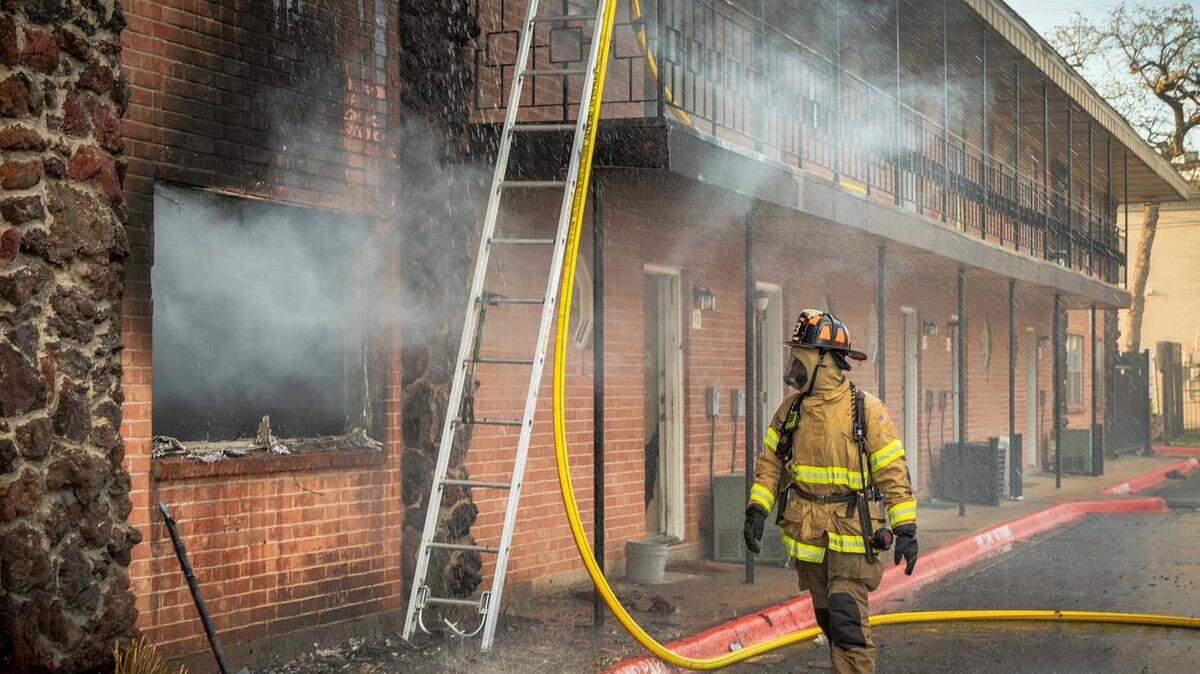 Fort Worth firefighters battle a blaze at an east Fort Worth apartment complex Wednesday evening. The two-alarm fire damaged 13 units and displaced 60 people.