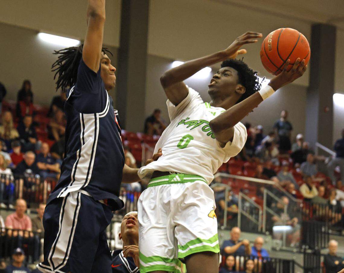 Eaton guard Mitch Tshibangu (0) shoots over Allen’s Giovanni Watt (10) during a UIL Class 6A Division I boys regional semifinal basketball game at Coppell High School in Coppell, Texas, Tuesday, March 3, 2026.