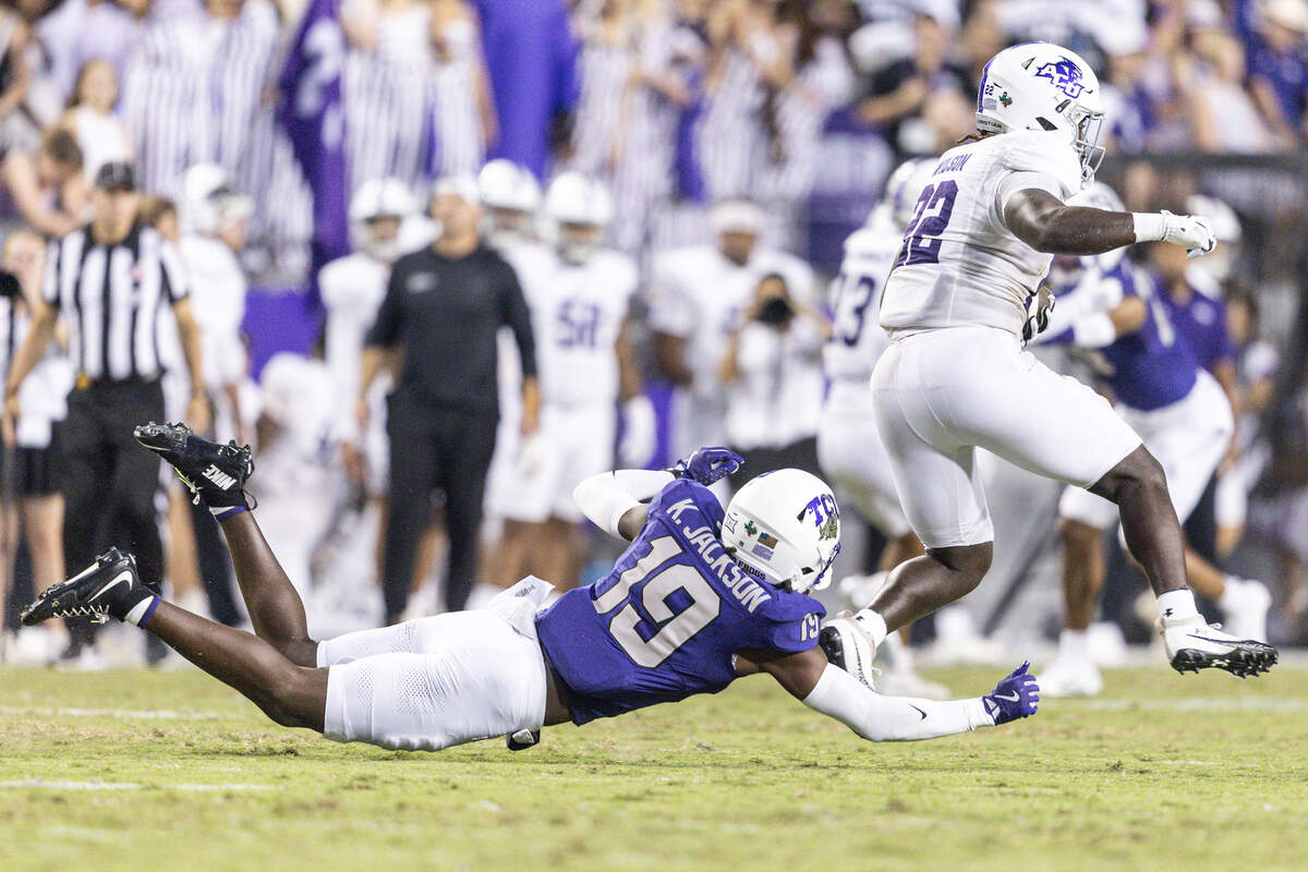 TCU safety Kylin Jackson misses a tackle on Abilene Christian running back EJ Wilson in the first half Saturday.