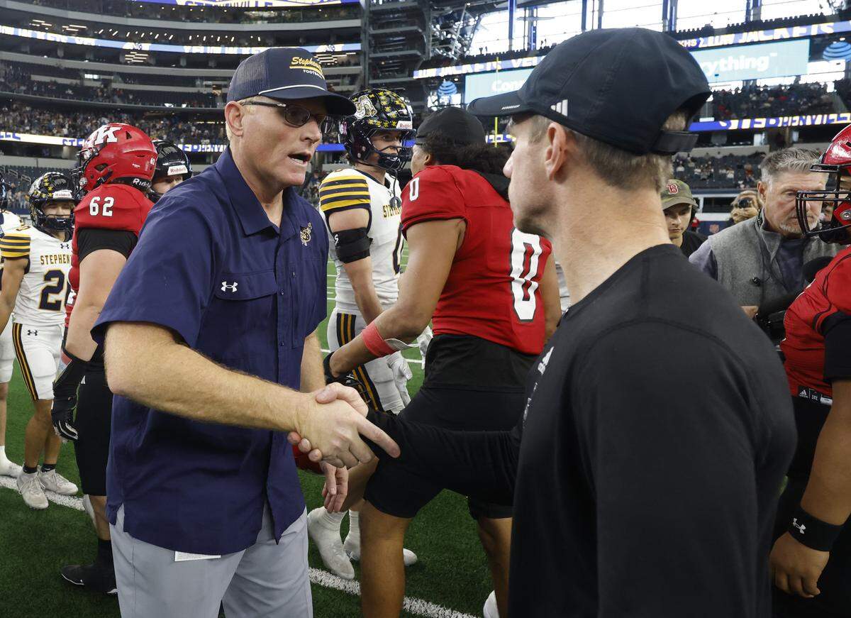 Stephenville head coach Sterling Doty shakes the hand of Kilgore head coach Clint Fuller after defeating the Bulldogs in the UIL Class 4A Division I championship game on Friday Dec. 19, 2025 at AT&T Stadium in Arlington, Texas.