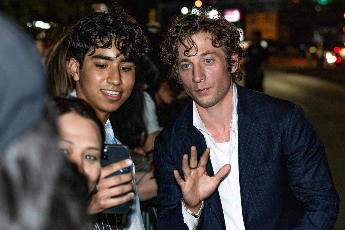 Actor Jeremy Allen White, who stars as Kerry Von Erich, poses for photos with fans upon arrival for the world premiere of the movie “The Iron Claw,” at the Texas Theater in Dallas on Wednesday, Nov. 8, 2023.