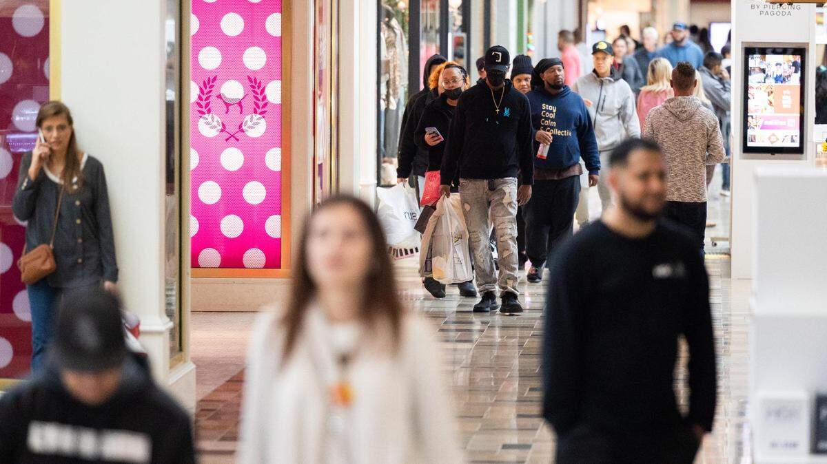 Black Friday shoppers walk between stores Friday, Nov. 25, 2022, at North East Mall in Hurst.