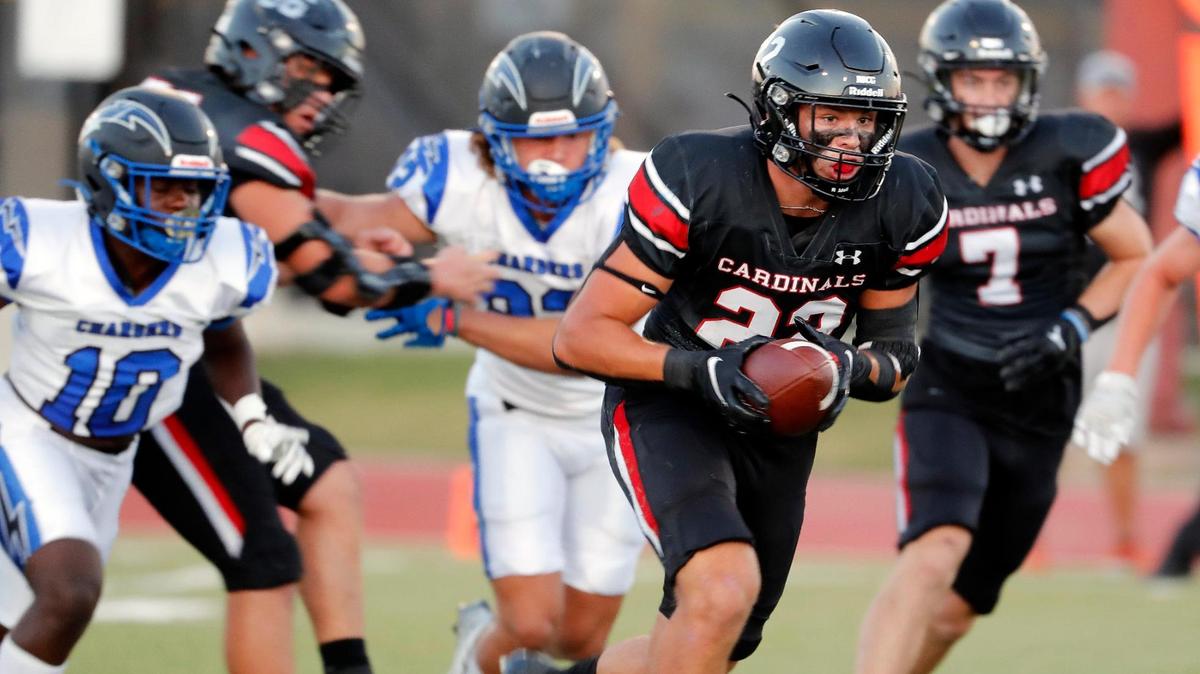 Fort Worth Christian running back Luke Anderson (22) breaks upfield to set up a Cardinal touchdown in the first half of a high school football game at Barrow Field in North Richland Hills Texas, Friday, Sept. 30, 2022.