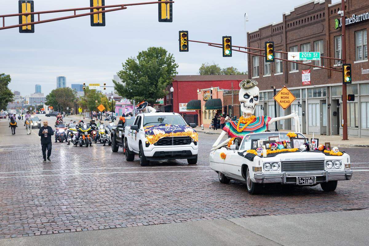 Parade participants ride in their float on Main Street for the Dia De Los Muertos Parade in Northside Fort Worth on Saturday, Nov. 1, 2025.