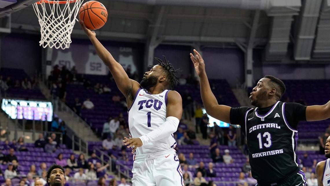 TCU guard Mike Miles Jr. (1) shoots against Central Arkansas guard Eddy Kayouloud (13) during the first half of an NCAA college basketball game in Fort Worth, Texas, Wednesday, Dec. 28, 2022. (AP Photo/LM Otero)