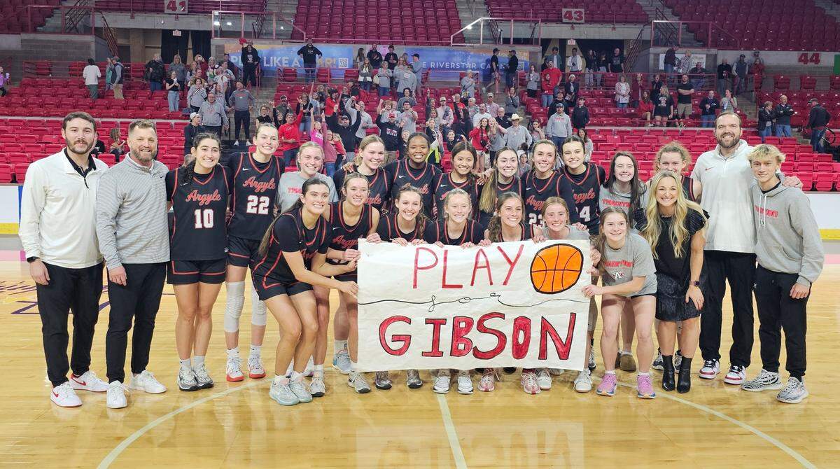 The Argyle girls basketball team poses after defeating Amarillo Tascosa 61-59 in two overtimes in a Class 5A Region I semifinal on Friday, February 23, 2024 at the Yeager Coliseum in Wichita Falls, Texas.