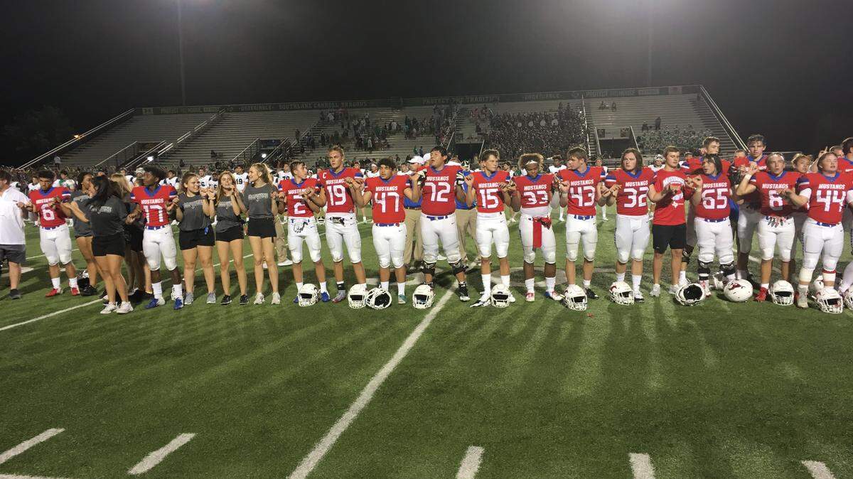 Grapevine celebrates a season-opening victory over Azle