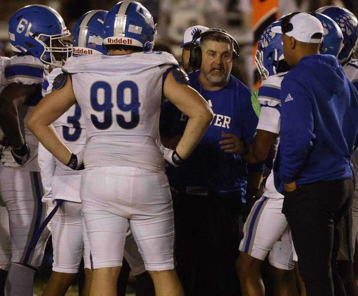 Brewer head coach Marte Amrine talks to the team with just minutes remaining in the second half of a UIL Conference 5A D1 Bi-District playoff game between Arlington Heights and Brewer at Farrington Field in Fort Worth, Texas, Friday, Nov. 14, 2025.