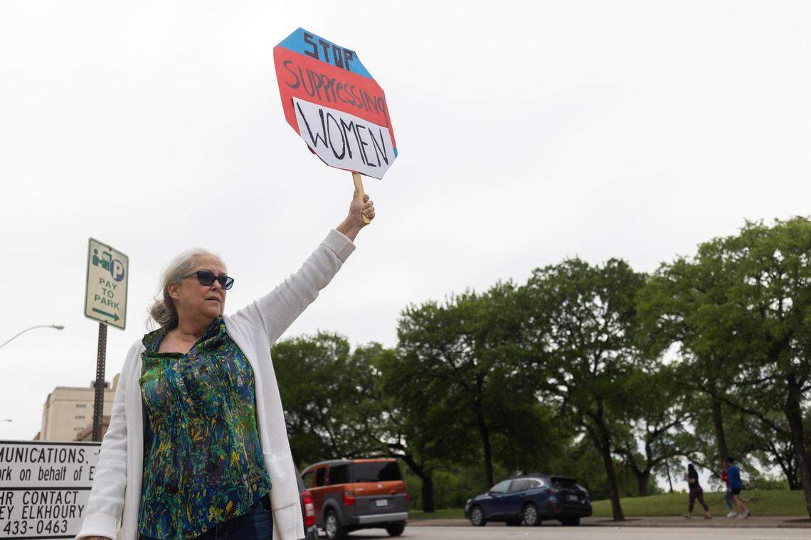 Terri Fowler holds up a sign against abortion bans Tuesday, May 3, 2022, near the Tarrant County Courthouse.