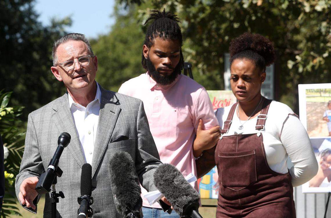 Stephen Stewart, left, an attorney representing Tariq Williams, center, and Marissa Mitchell speaks during a press conference on Monday, October 4, 2021, concerning the of Bakari Williams, 3, from a brain-eating amoeba he most likely came in contact with at the Don Misenhimer Park splash pad in Arlington.