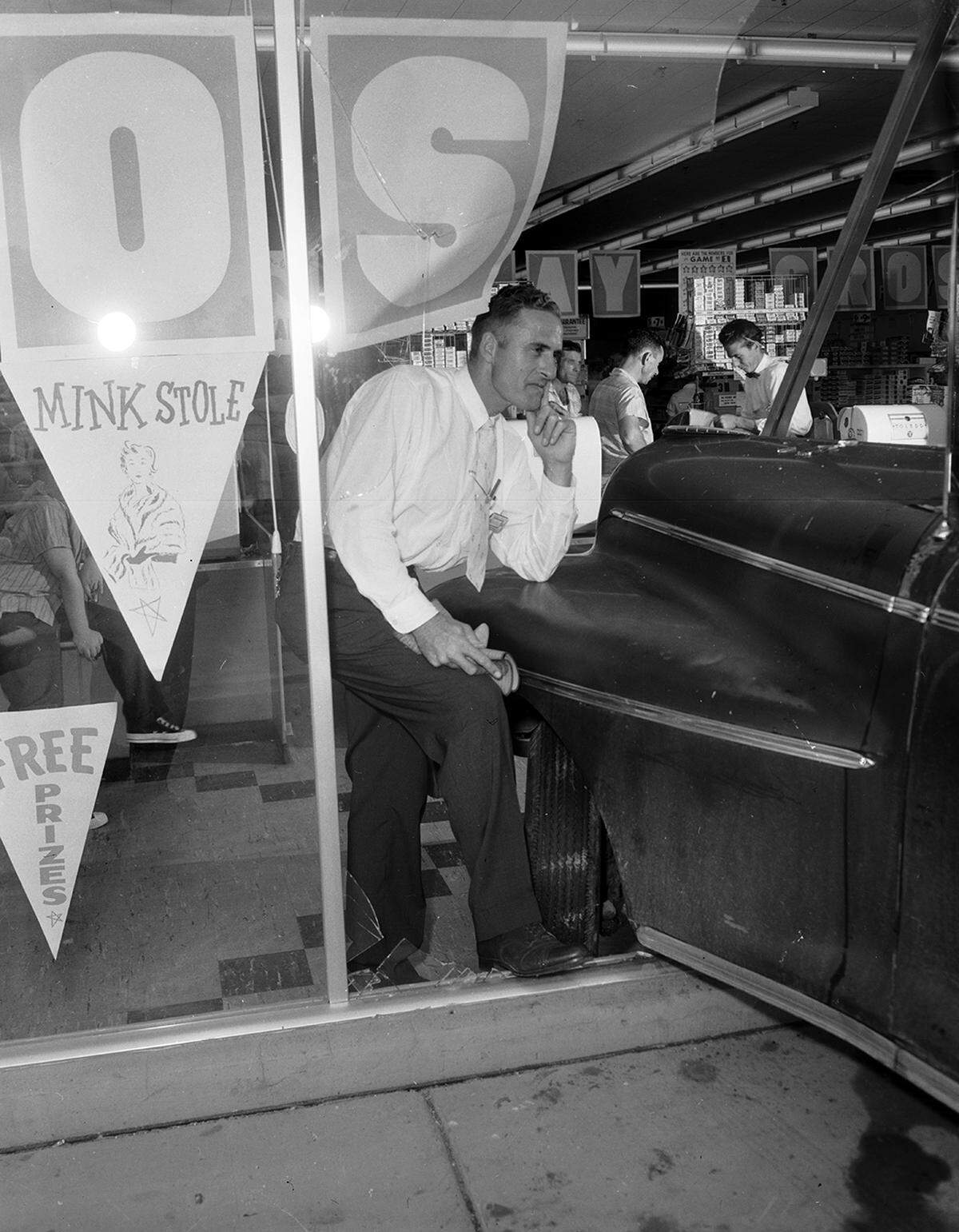 Aug. 23, 1958: Shoppers keep stocking up for Sunday dinner after an auto plowed into a window at the Safeway Store, 3601 Avenue E, on Saturday. Manager B.C. “Bill” Simmons surveys the damage. The driver, Mrs. Nora Pyles of 2108 Langston, reported that her brakes failed and the car skidded on pavement made slick by rain. (The location is where Foodland Markets is today.)