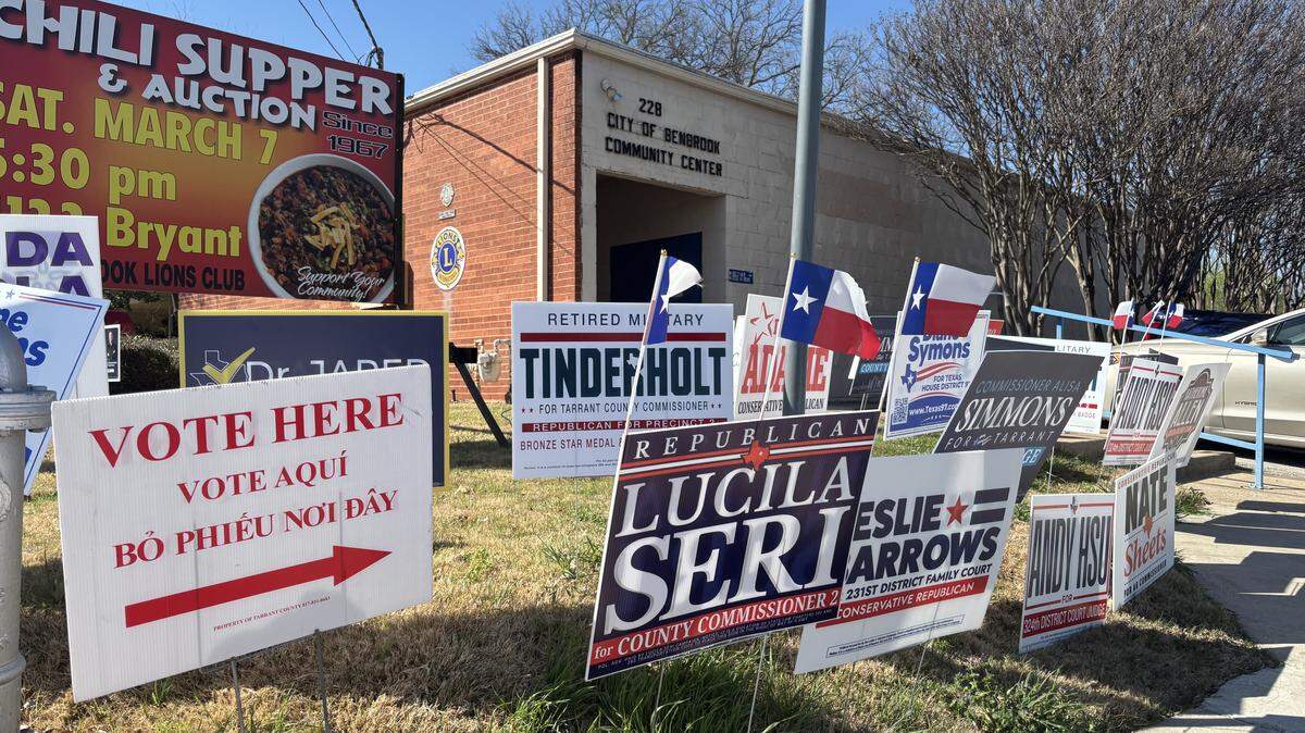 Campaign signs line the curb of San Angelo Avenue in front of the Benbrook Community Center on March 3, 2026 during the primary election day.