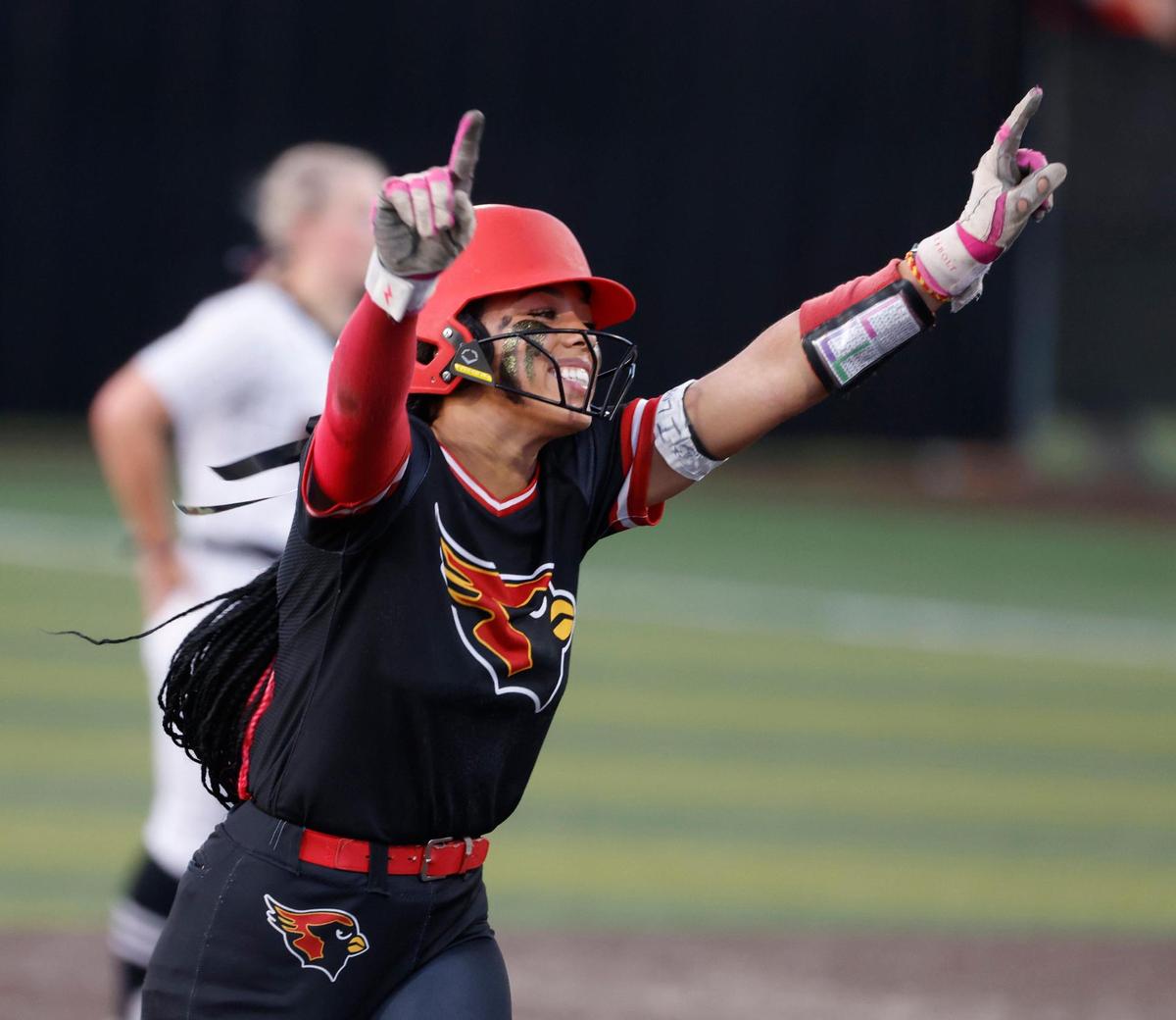 Melissa center fielder Finlee Williams (2) celebrates her second home run as she rounds second during the UIL softball state semifinals 5A D1 playoff game at Trojan Softball Field in Euless, Texas, Wednesday, May 21, 2025.