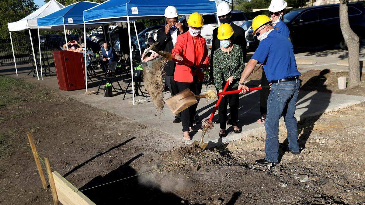Officials, including Mayor Betsy Price, break ground during the dedication ceremony for the Slone Vocation Center at Hope Farm on Tuesday.
