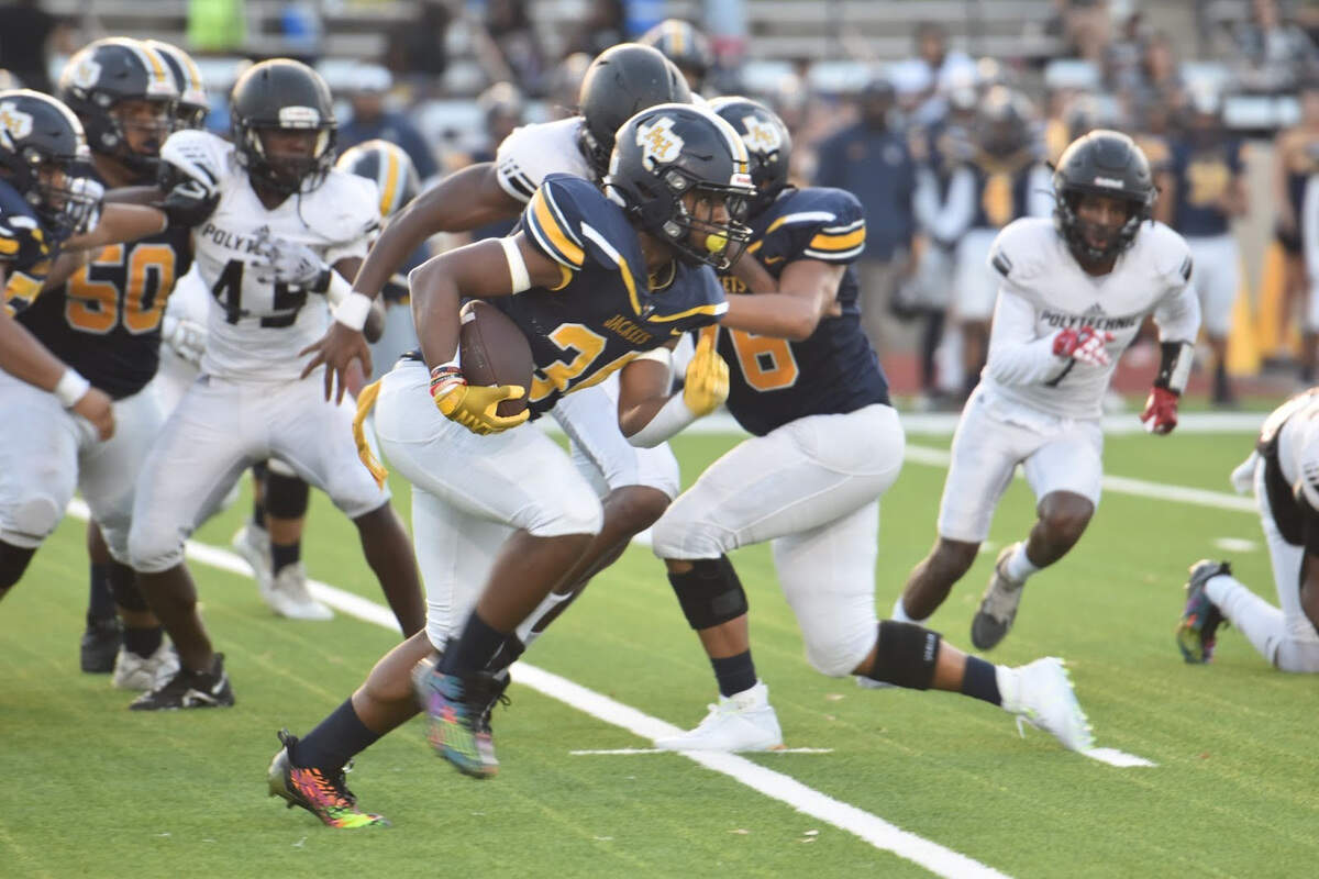 Fort Worth Arlington Heights’ Latreal Brooks (34) scores a touchdown during a high school football game against Fort Worth Polytechnic at Farrington Field in Fort Worth, Texas Friday, September 15, 2023.