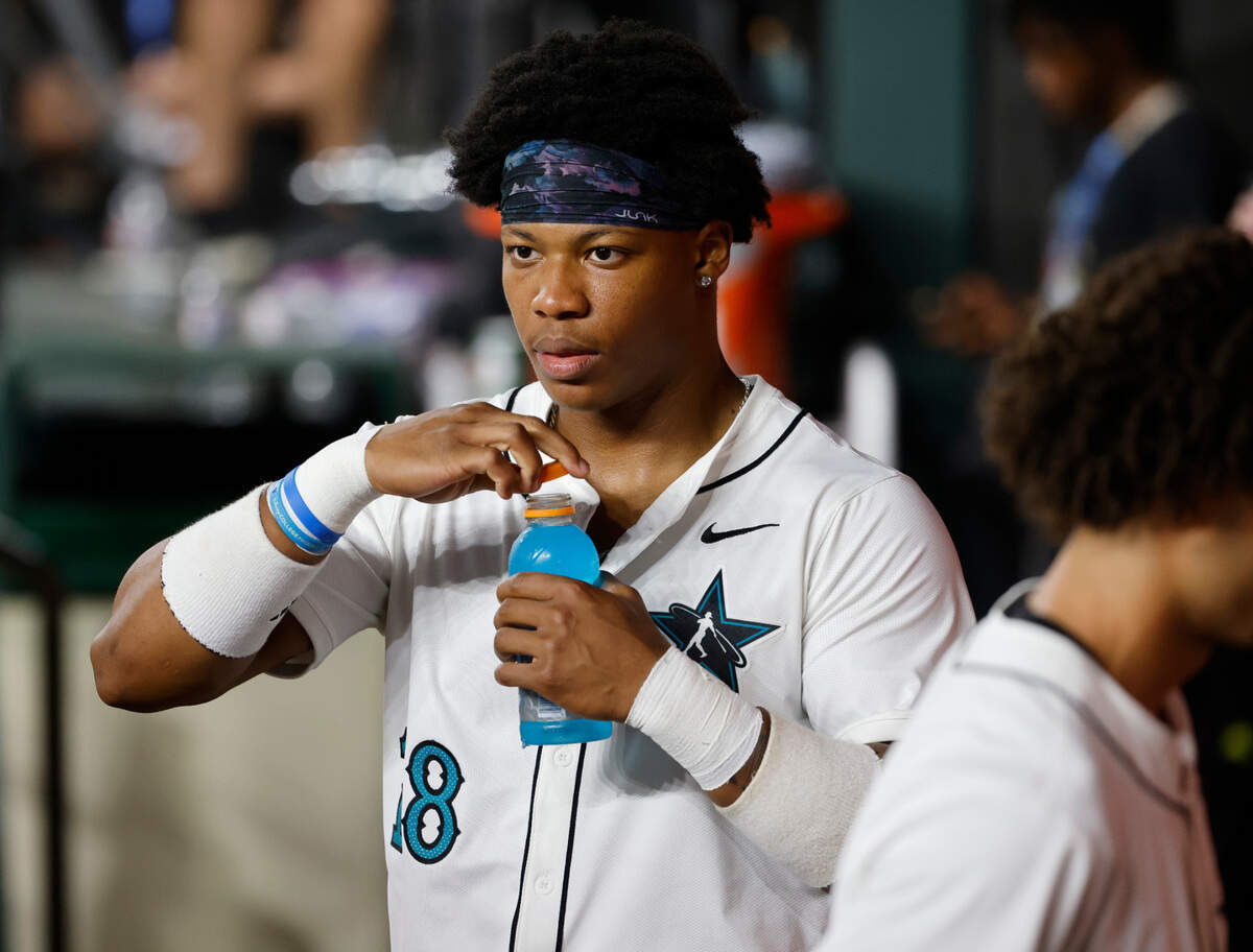 American League right fielder Michael Smith (18) from Prairie View A&M grabs some hydration in the dugout during the HBCU Swingman Classic at Globe Life Field in Arlington, Texas, Friday July 12, 2024.