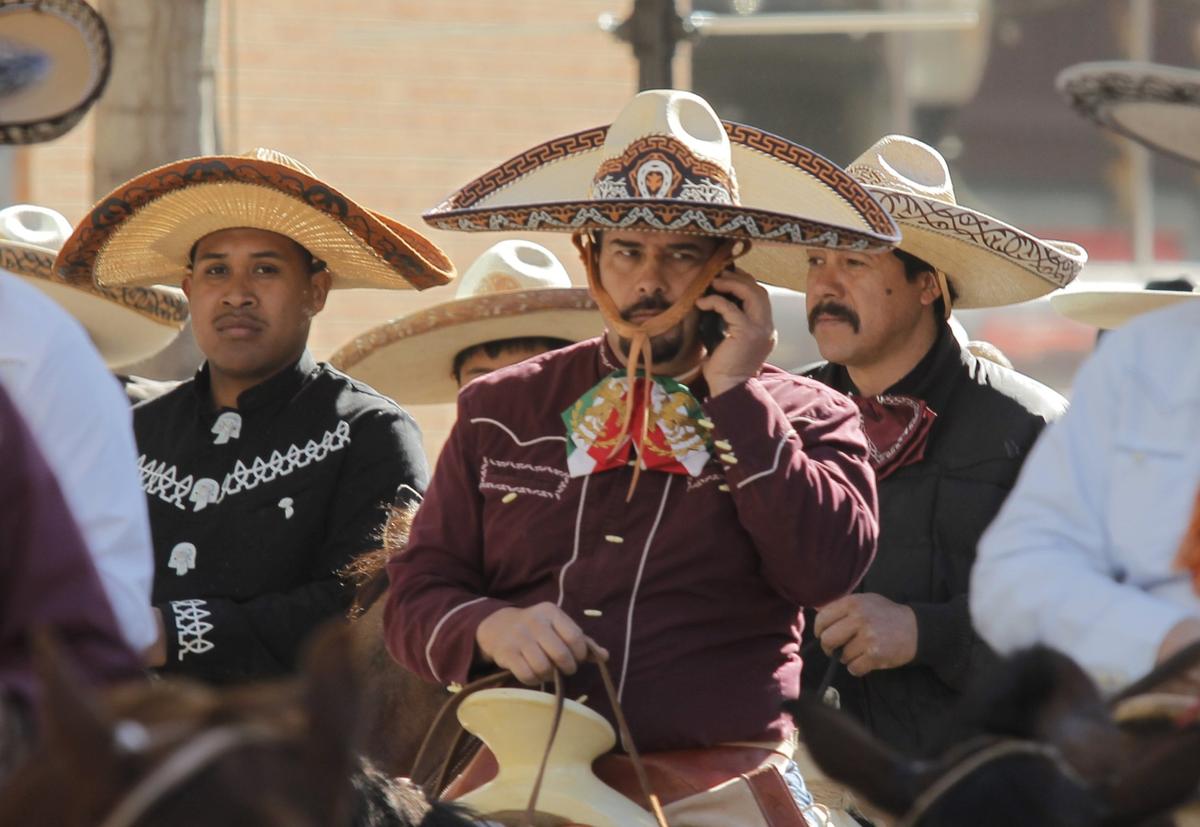Jan. 14, 2012: A rider talks on his phone in the Fort Worth Stock Show and Rodeo’s All-Western Parade in downtown.