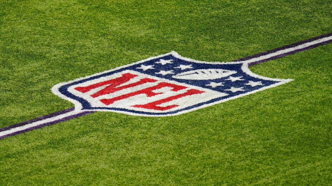 The NFL logo is seen on the field in U.S. Bank Stadium before an NFL football game between the Minnesota Vikings and the Tennessee Titans, Sunday, Sept. 27, 2020, in Minneapolis. (AP Photo/Charlie Neibergall)