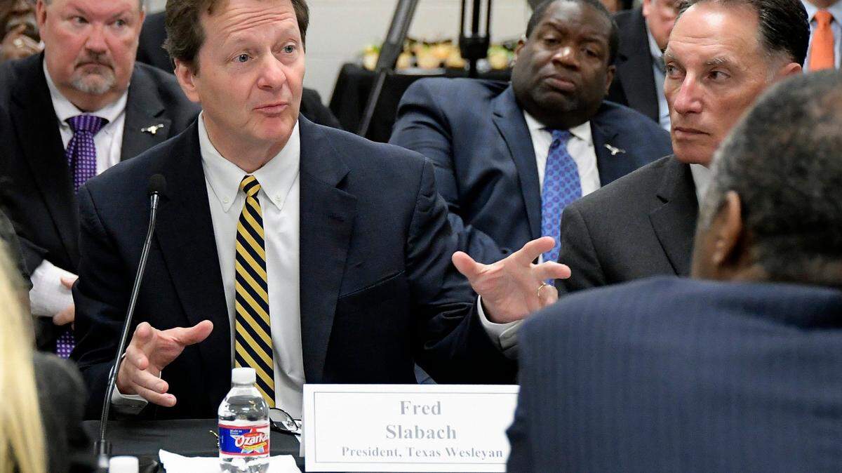 Texas Wesleyan President Fred Slabach talks with former HUD Secretary Ben Carson during a roundtable discussion in this file photo.