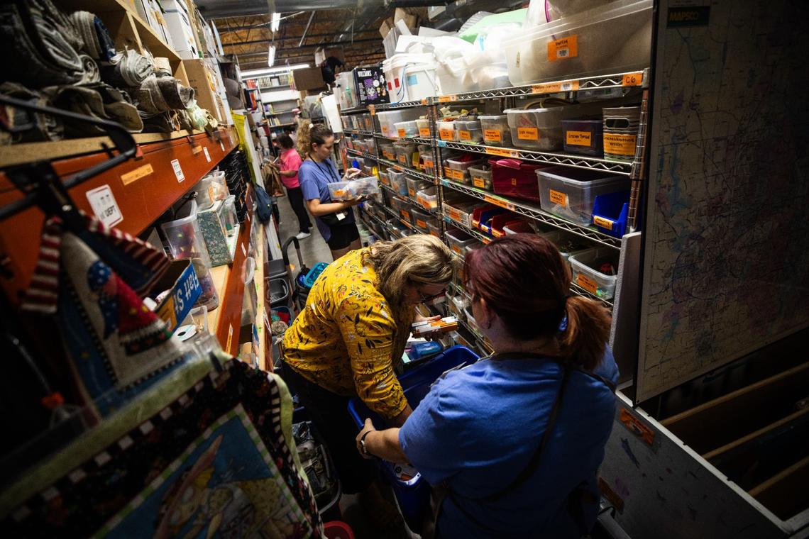 Teachers and volunteers sift through a variety of school supplies and decorations on July 23, 2024, at The Welman Project in Fort Worth. Teachers shop for free in the Educator Warehouse for supplies.