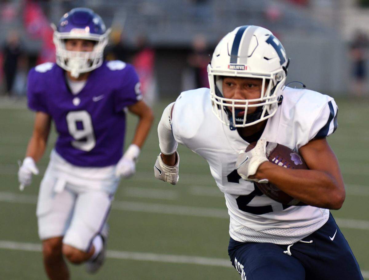 Paschal’s Connor Hadley, left, chases after Richland’s Paul Samuel runs back an interception in the first quarter of their non-district football game Thursday, September 2, 2021 at the Birdville Fine Arts Athletic Complex in North Richland Hills, Texas. Special/Bob Haynes