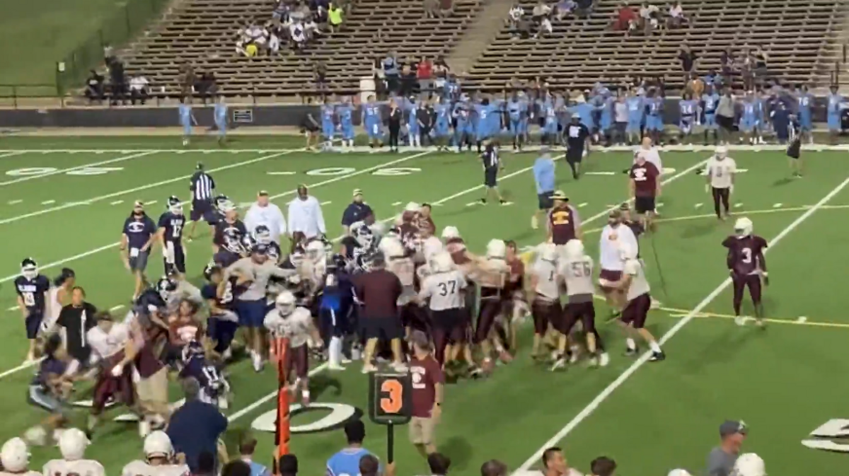 An Oklahoma football coach was placed on leave after a fight between El Reno and Clinton high schools during a game, officials say. Screengrab from KFOR
