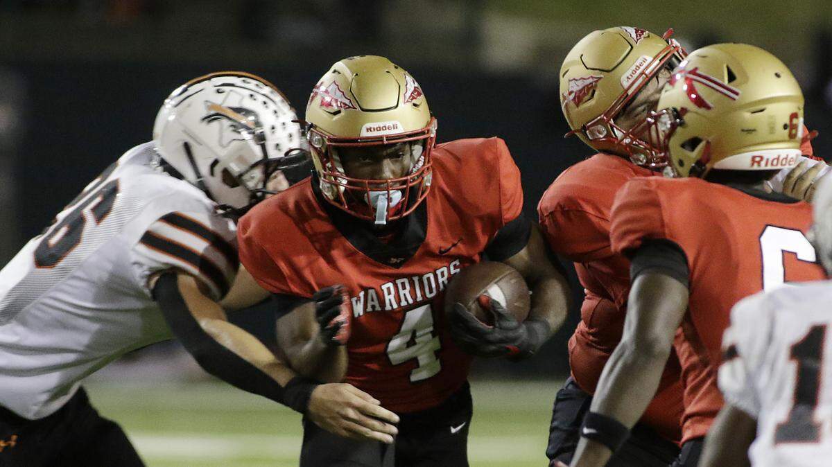 South Grand Prairie’s Josiah Lucas squeezes through a hole against Haltom during their game at the Gopher-Warrior Bowl on Friday, Oct. 31, 2025. 