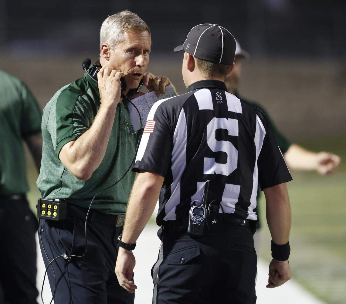 Lake Ridge head coach Kirk Thor talks to the side judge during the first half of a UIL football game between North Crowley and Lake Ridge at Vernon Newsom Stadium in Mansfield, Texas, Thursday, October 09, 2025.