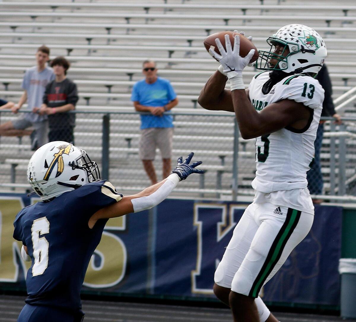 Carroll’s Rj Maryland (13) grabs a touchdown pass defended by Keller defensive back Colten Vargas (6) during a high school football game at Keller ISD Stadium in Keller, Texas, Friday Oct. 01, 2021. Carroll defeated Keller 49-13. (Special to the Star-Telegram Bob Booth)