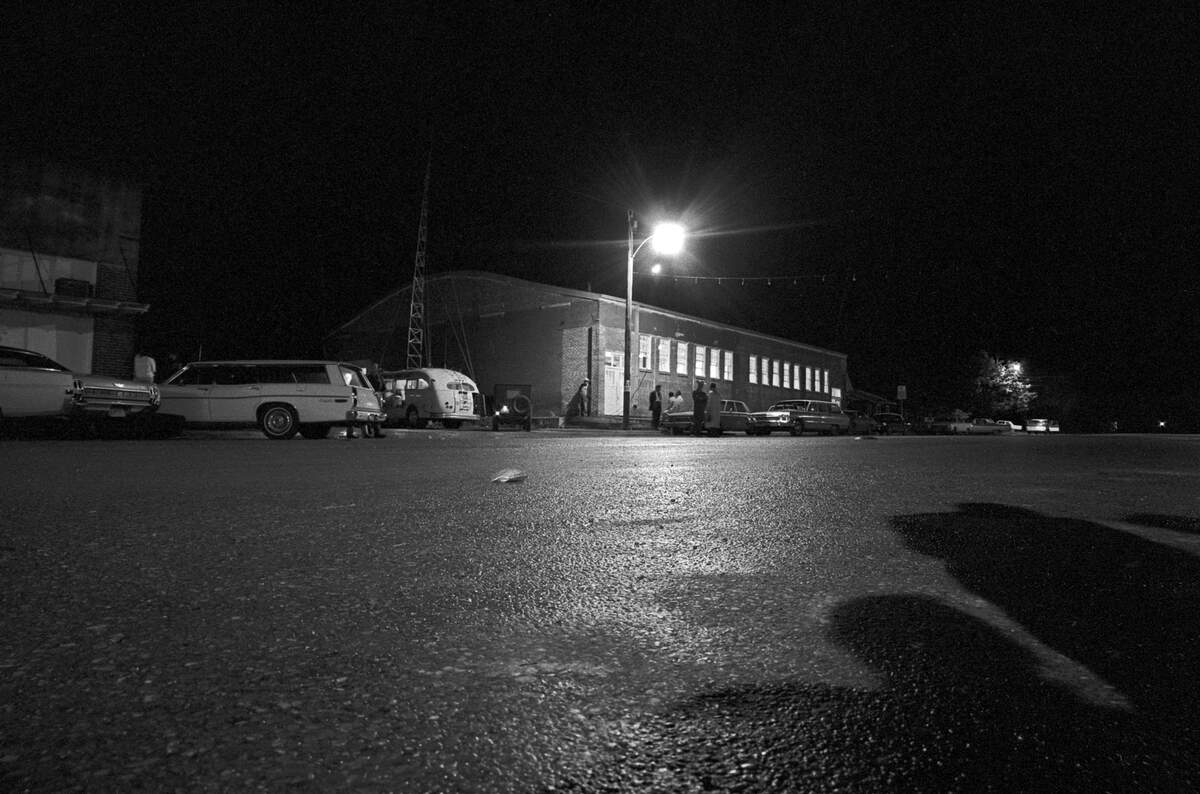Pictured is the school gymnasium in Dawson where volunteer workers set up a temporary morgue for victims of Texas’ worst air disaster to date. The red brick structure, built in the 1920s as a community center, is on Dawson’s busiest intersection