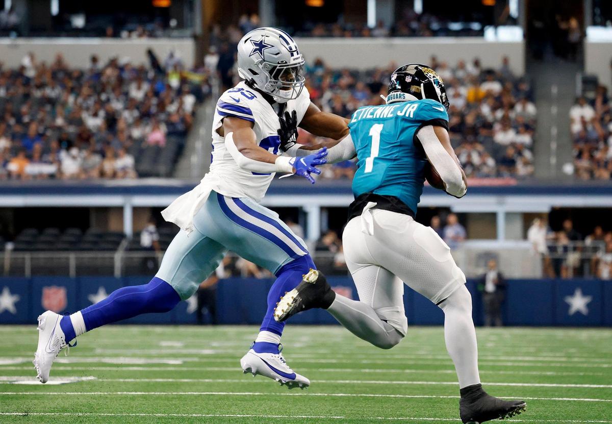 Dallas Cowboys linebacker Damone Clark prepares to tackle Jacksonville Jaguars running back Travis Etienne Jr. on Saturday, August 12, 2023, at AT&T Stadium in Arlington.