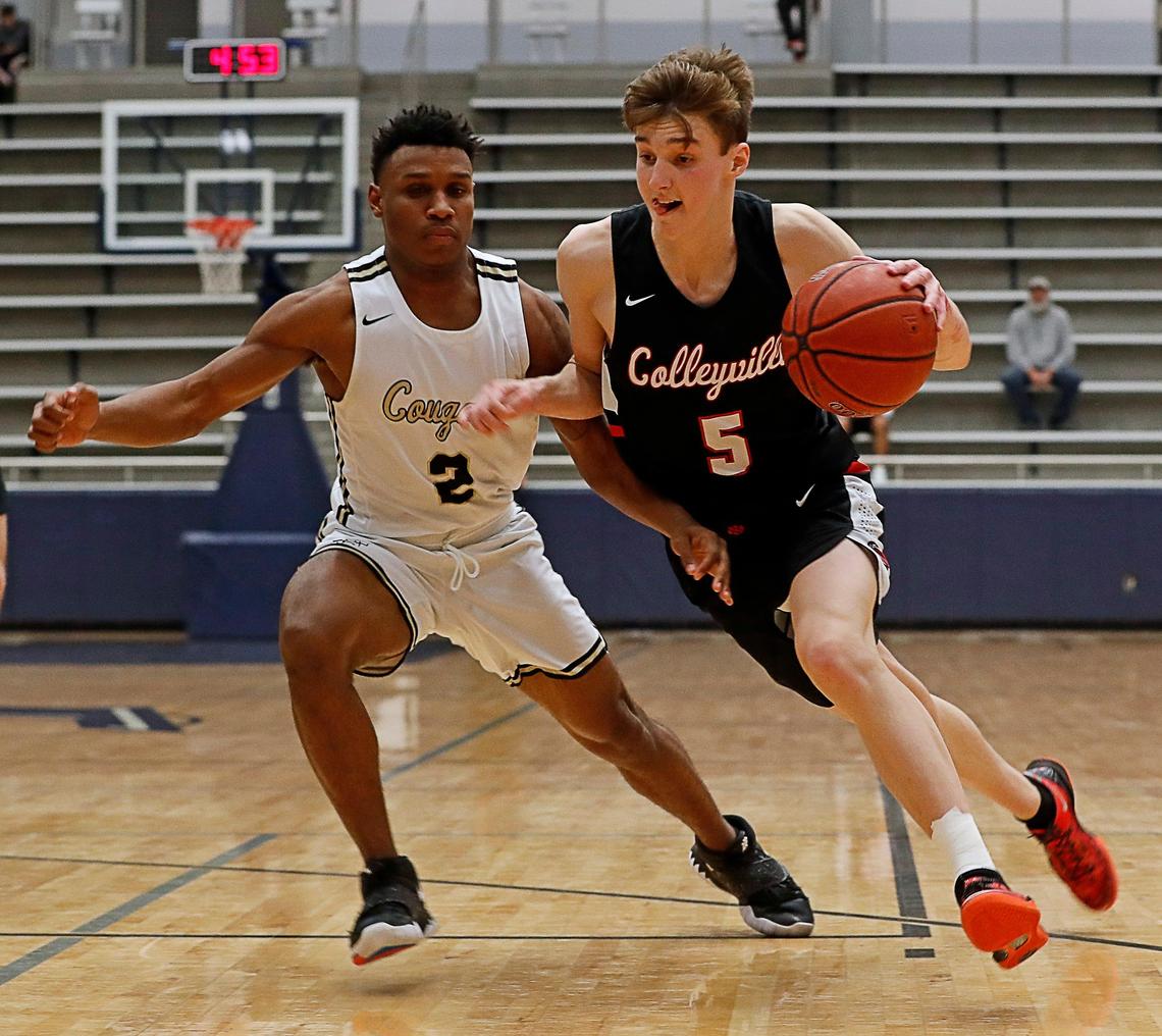 Colleyville Heritage forward Baylor Hebb (5) drives the ball on The Colony guard Myles Price (2) in the fourth quarter of a bi-district high school basketball playoff game at Flower Mound High School in Flower Mound, Texas, Tuesday, Feb. 25, 2020. Colleyville Heritage defeated The Colony 44-42 to advance in the playoffs. (Special to the Star-Telegram Bob Booth)