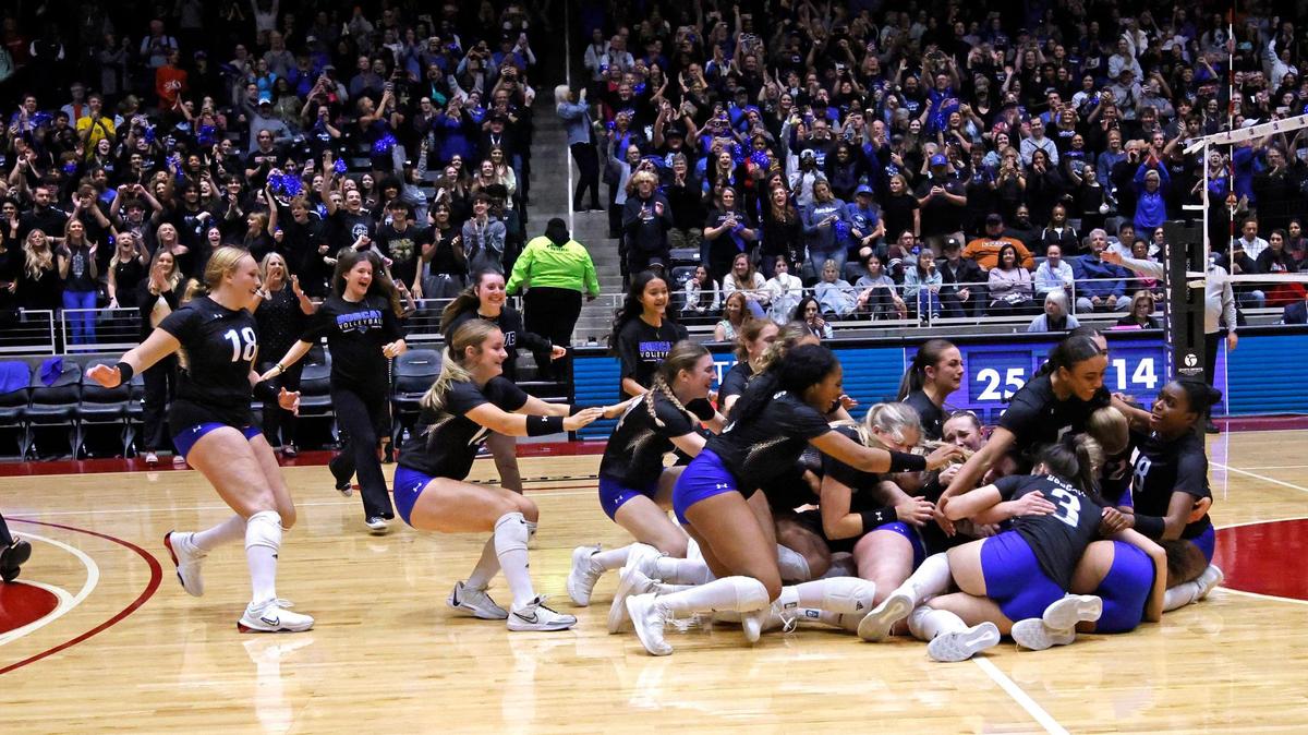 The Lady Bobcats storm the court after winning the UIL 6A D2 State Final volleyball match at Curtis Culwell Center in Garland Texas, Saturday, Nov. 23, 2024.