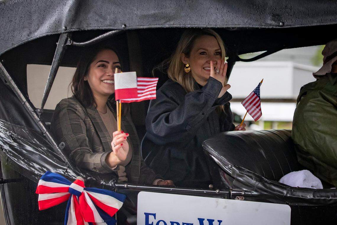 Fort Worth mayor Mattie Parker waves to people watching the Veterans Day Parade in Fort Worth on Friday, Nov. 11, 2022. Despite rain, hundreds of participants marched down North Forest Park Boulevard, waving American flags and signing a medley of military songs.
