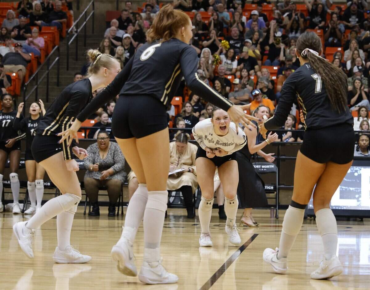 Eagle Mountain defensive specialist Lexi Nichols (4) reacts after a point during the second set of a Class 4A Division II volleyball state semifinal against Longview Spring Hill on Saturday at Wilkerson-Greines Activity Center in Fort Worth.