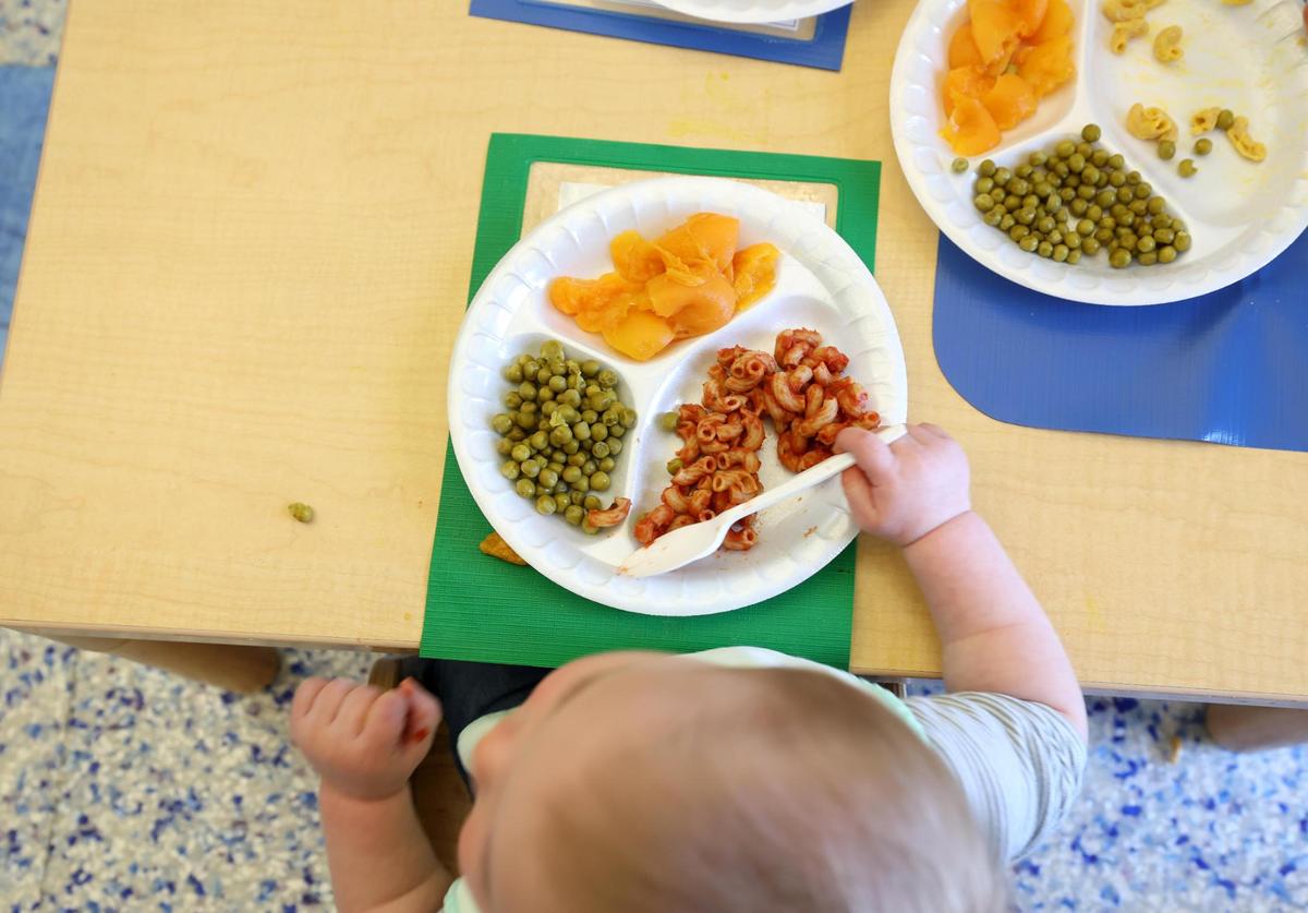 Rory, 1, eats lunch while being cared for at Kids’ Place Child Development Center on Wednesday, Jan. 15, 2025, in Fort Worth. Kids’ Place is a childcare center available to Cook Children’s and Texas Health Resources employees and provides flexible hours.