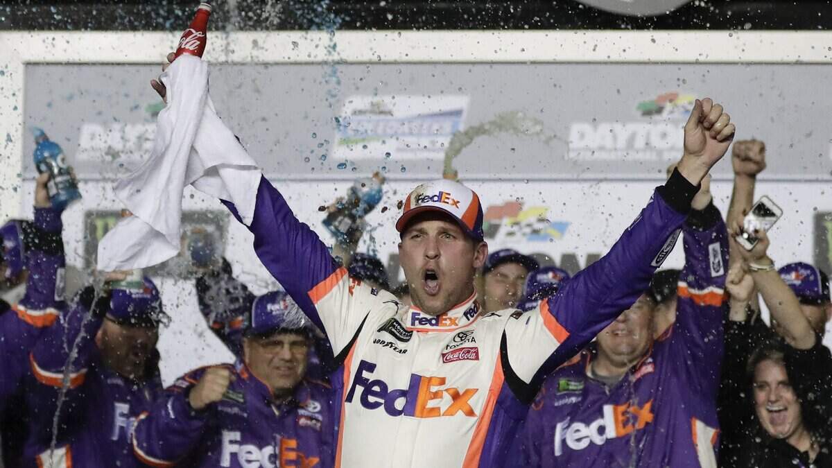 Denny Hamlin celebrates in Victory Lane after winning the NASCAR Daytona 500 auto race at Daytona International Speedway, Sunday, Feb. 17, 2019, in Daytona Beach, Fla. (AP Photo/John Raoux)