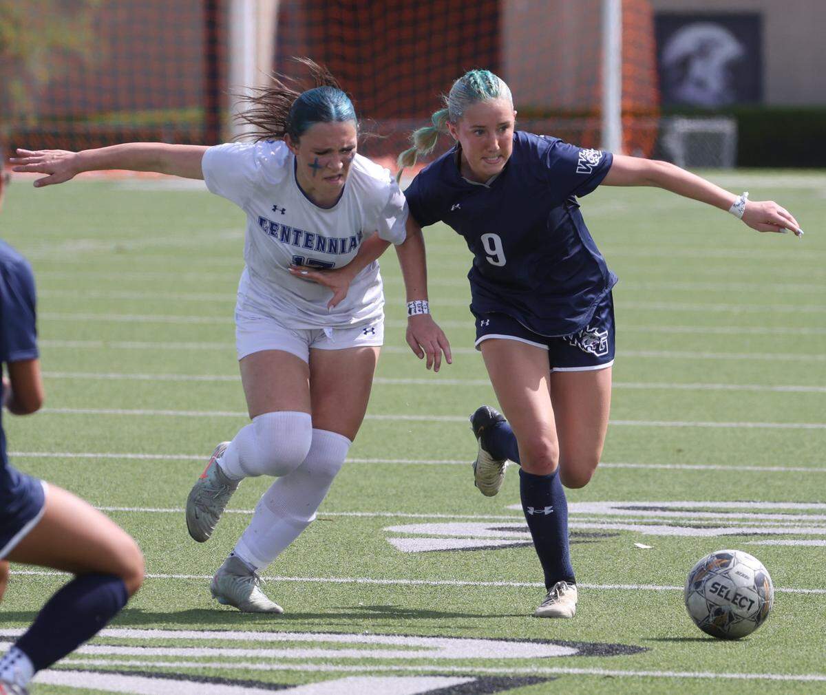 Prosper Walnut Grove midfielder Brynlie Ward (9) keeps the ball away from Burleson Centennial midfielder Claire Gambrell (17) during the first half of a UIL Conference 5A Division I state semifinal soccer game at Keller ISD Athletic Complex in Keller, Tx. Friday, April 03, 2026.