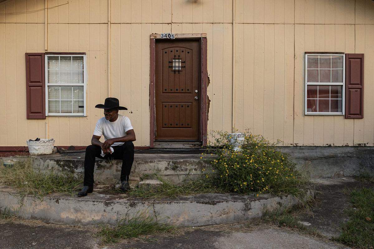 Jeff Pointer sits at the steps of his childhood home where he grew up at Fite Street and Mosier Valley Road on Wednesday, Sept. 24, 2025. Pointer is a member of the Mosier Valley Property Owners Association and is working on revitalizing the community and highlighting its historical significance. 